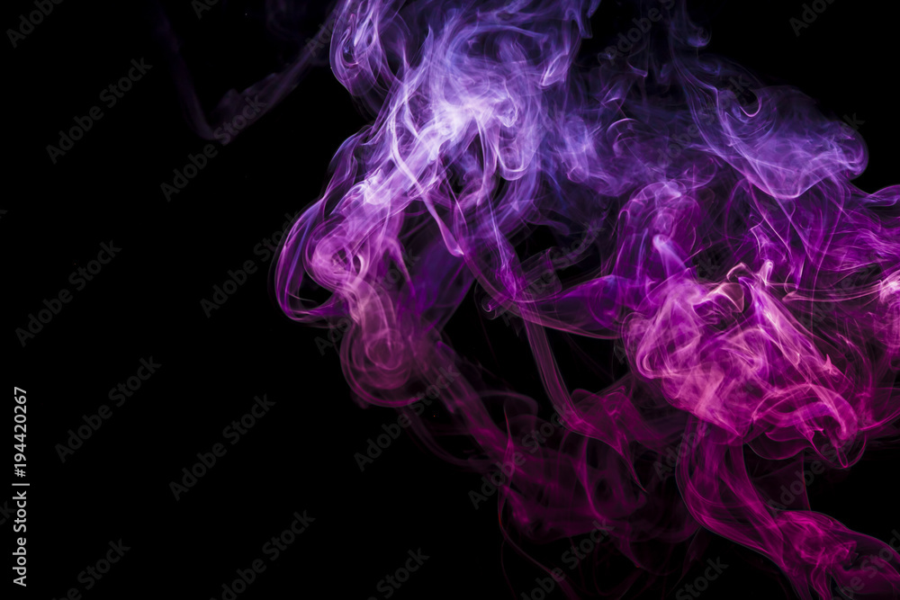 Fototapeta premium Colored smoke on black background