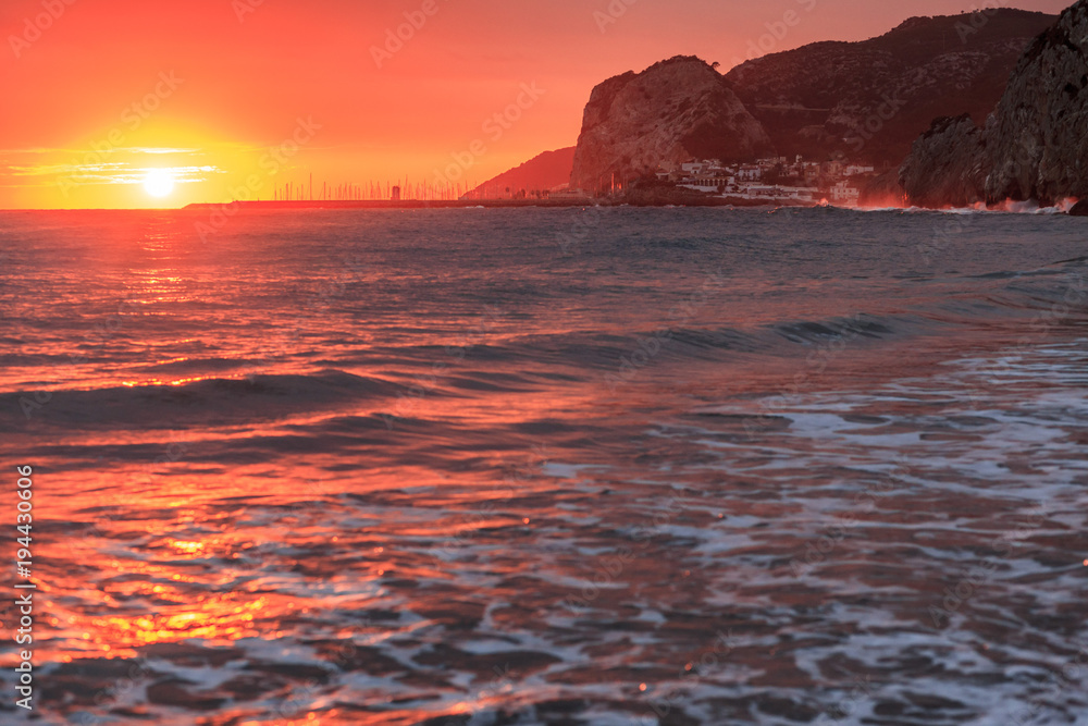 Mediterranean sea sunset at Port Ginesta beach, Sitges, Catalonia, Spain.