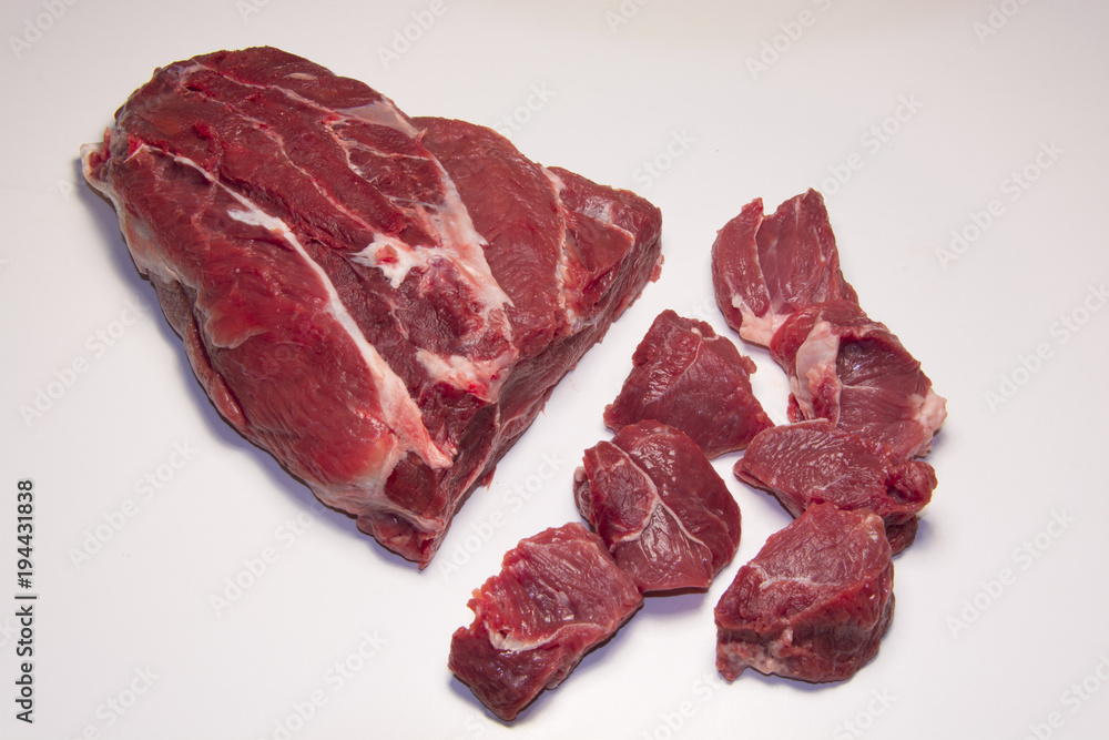 Raw pieces of beef meat for stew , goulash or ragout