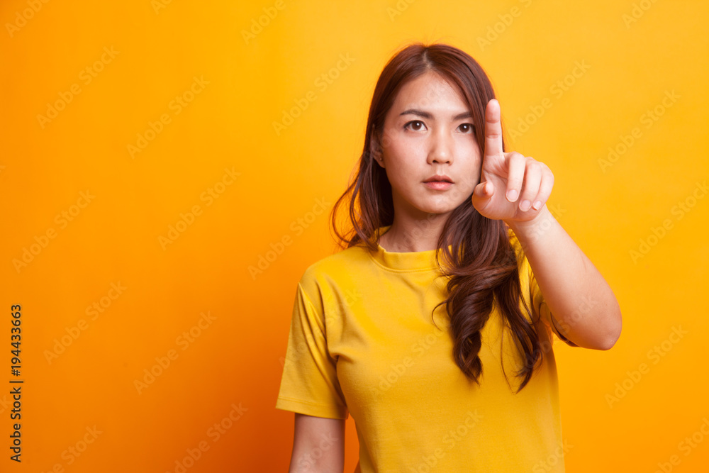 Asian woman touching the screen with finger. Asian woman touching the screen with finger.