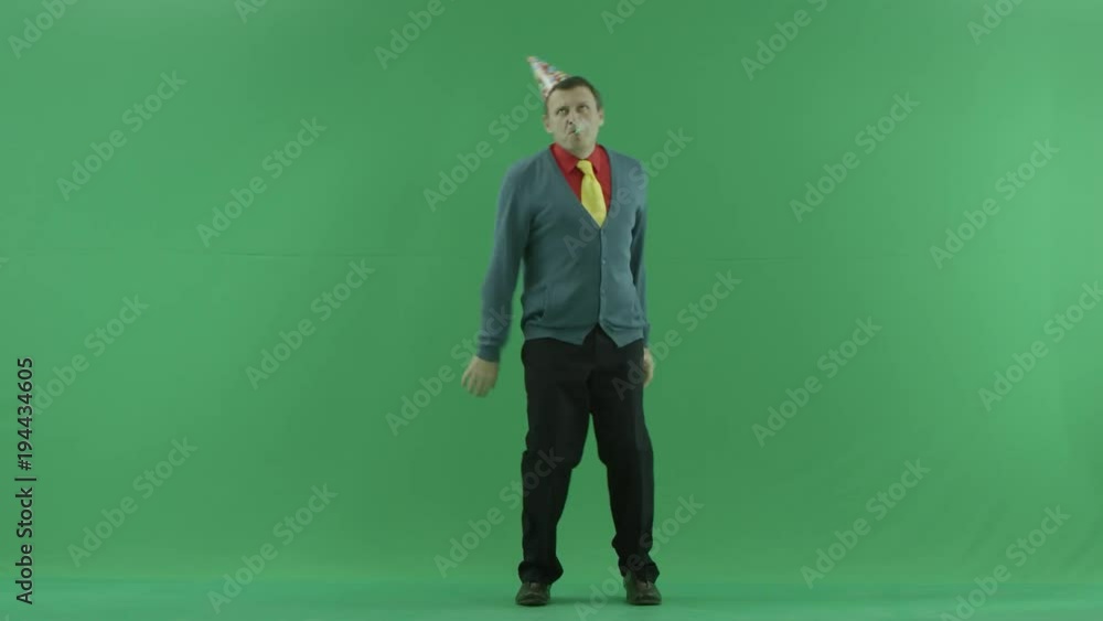 Funny mature man blows in whistle and dances, green chroma key background Funny mature man blows in whistle and dances, green chroma key background