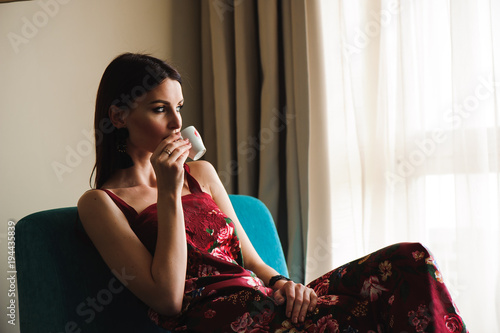 Closeup portrait of beautiful woman drinking coffee