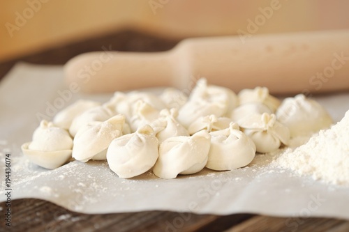 Homemade dumplings and flour on the table 
