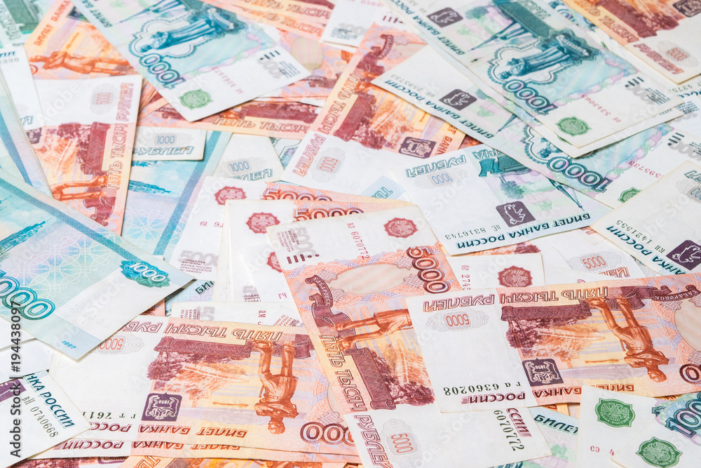 One and Five thousand roubles banknotes isolated on white background. Background concept. One and Five thousand roubles banknotes isolated on white background. Background concept.