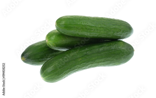 Four small bite size dipping cucumbers isolated on white background.