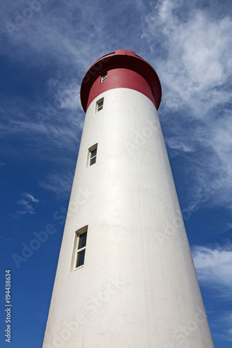  Red and White Lighthouse Extending Towards Blue Cloudy Sky