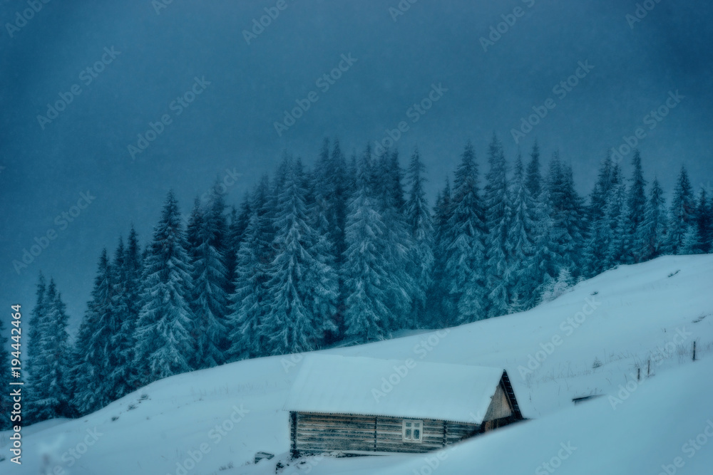 Wooden house in the winter in the mountains Wooden house in the winter in the mountains