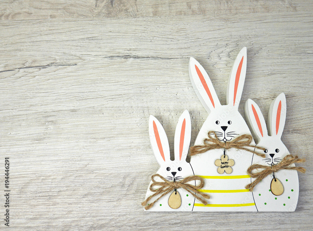 Three Bunny on wooden background for happy easter
