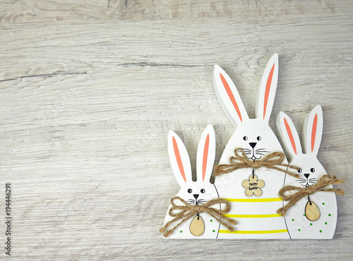 Obraz na płótnie Three Bunny on wooden background for happy easter w salonie