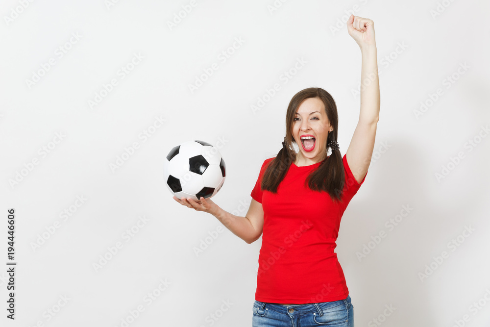 Overjoyed European young woman, two fun pony tails, football fan or player in red uniform holding classic soccer ball isolated on white background. Sport football health, healthy lifestyle concept. Overjoyed European young woman, two fun pony tails, football fan or player in red uniform holding classic soccer ball isolated on white background. Sport football health, healthy lifestyle concept.