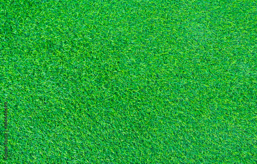 Fototapeta premium short green turf for house decoration, fake plastic grass background and texture