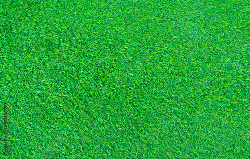 short green turf for house decoration, fake plastic grass background and texture