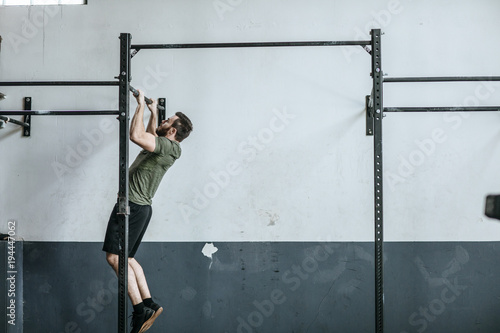Man Doing Workoutst at Gym © LStockStudio