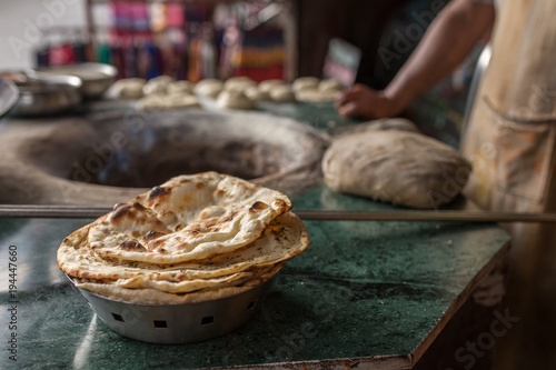 Obraz na plátně Tandoori naan or roti - indian flat bread baked in clay oven