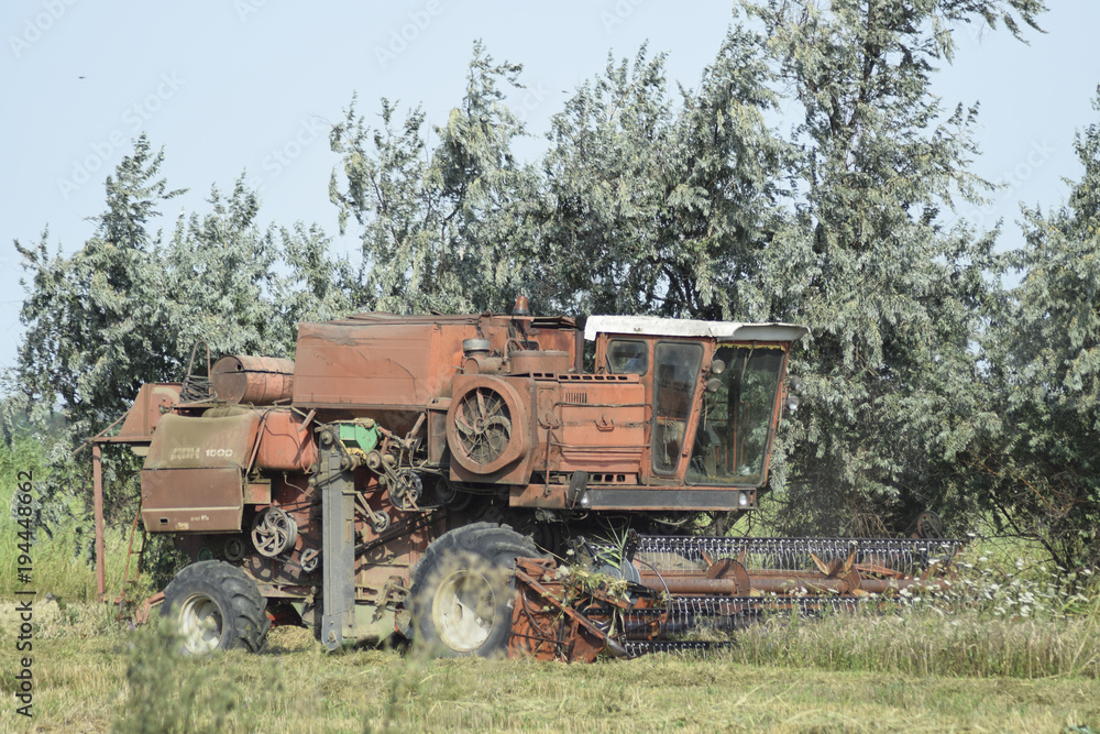 Old rusty combine harvester.
