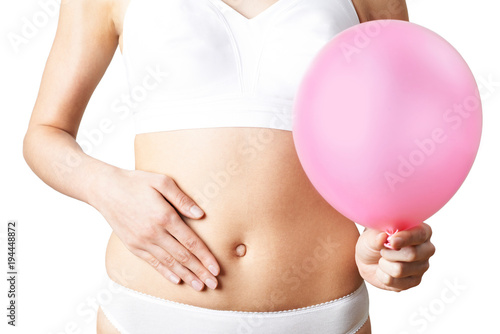Принти на полотні Close Up Of Woman Wearing Underwear Holding Pink Balloon And Touching Stomach