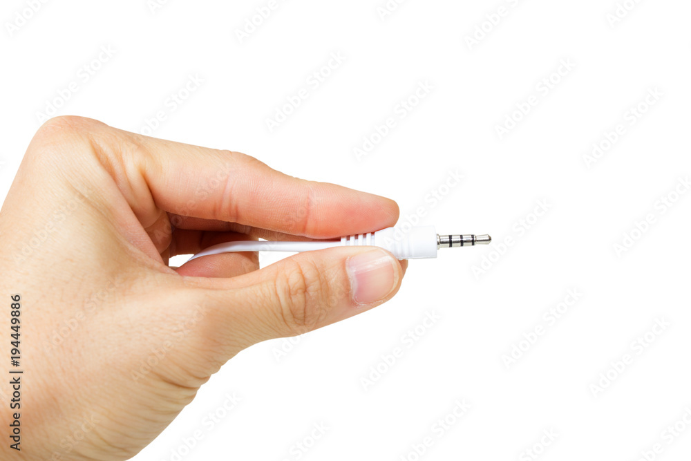 Hand holding Socket in ear headphones isolated on white background. Hand holding Socket in ear headphones isolated on white background.