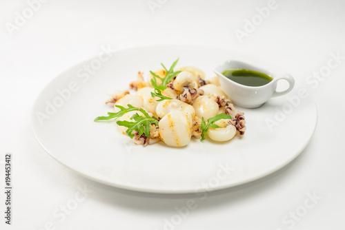 Fried octopus and pine with green sauce
