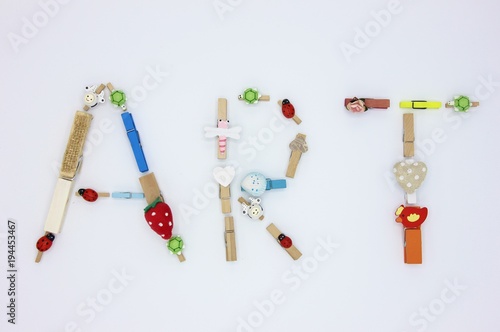 Word ART made by colorful clothespins with hearts and animals on white background