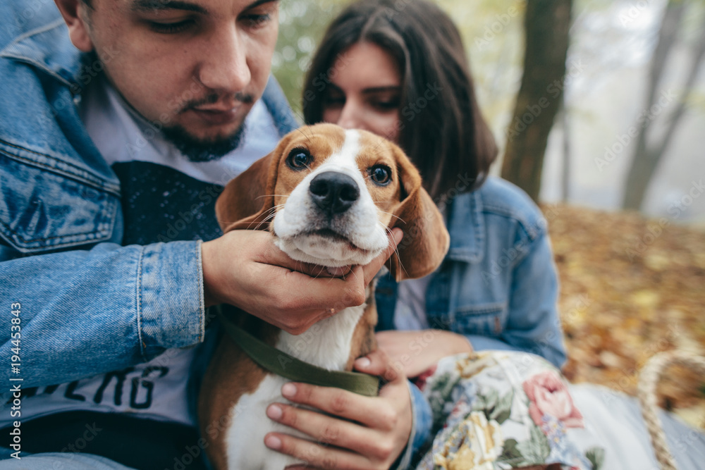 Couple with dog family beagle