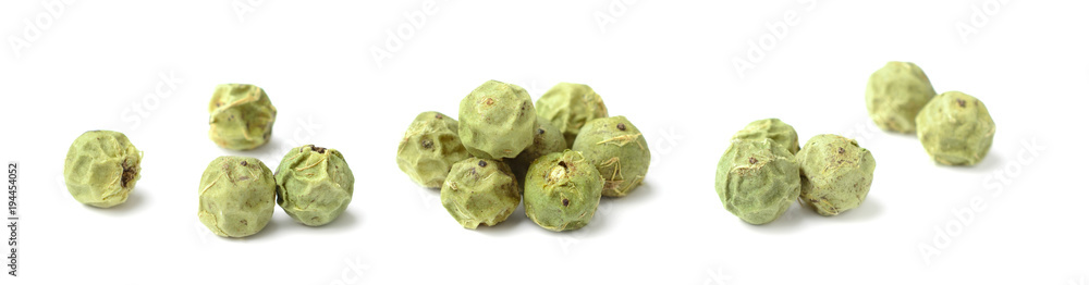 Fototapeta premium closeup of dried green peppercorns isolated on white
