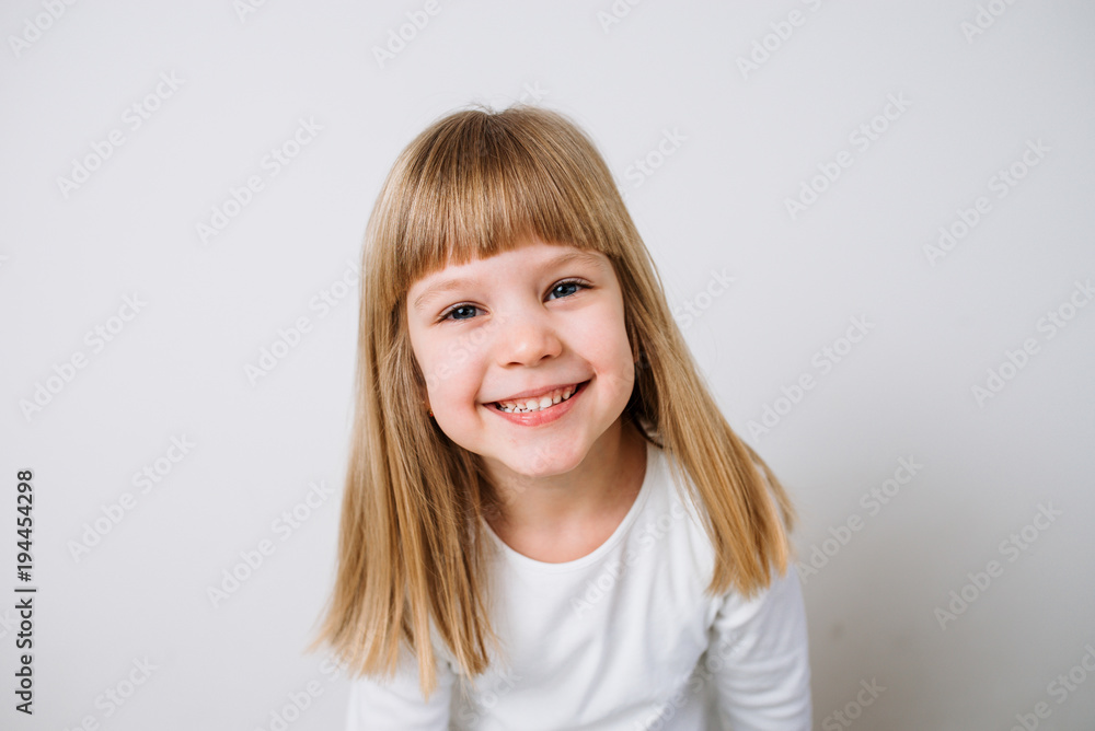 Joyful little girl on isolated background. Close-up Joyful little girl on isolated background. Close-up