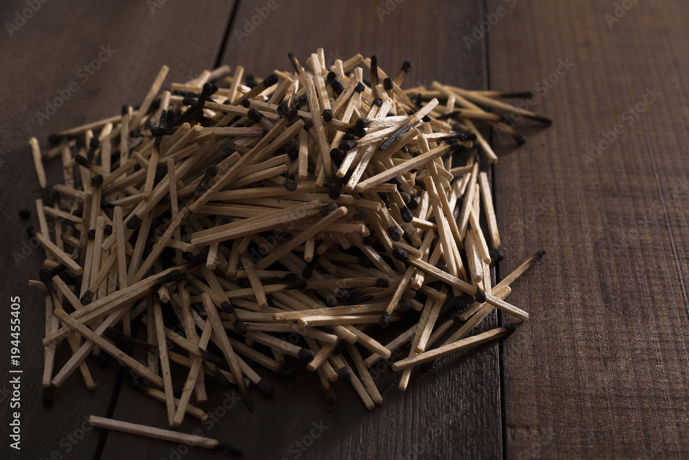 many matches stitched used on a wooden background many matches stitched used on a wooden background