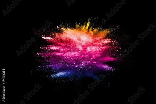 Multicolored powder explosion cloud isolated on black background. Freeze motion of color dust particles splash.