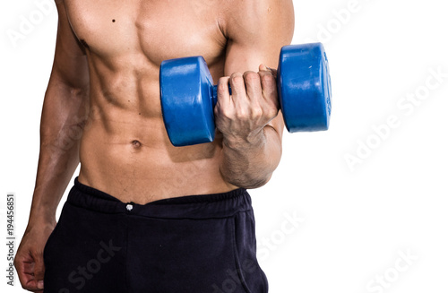 Muscular bodybuilder lifting and pumping up with dumbbell on isolated background