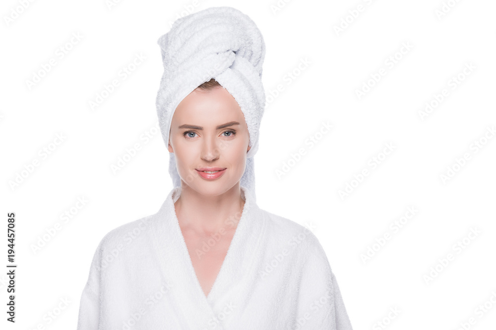 Portrait of woman in bathrobe and towel on hair isolated on white