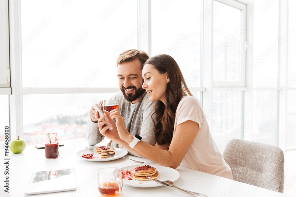 Happy young couple having breakfast Happy young couple having breakfast