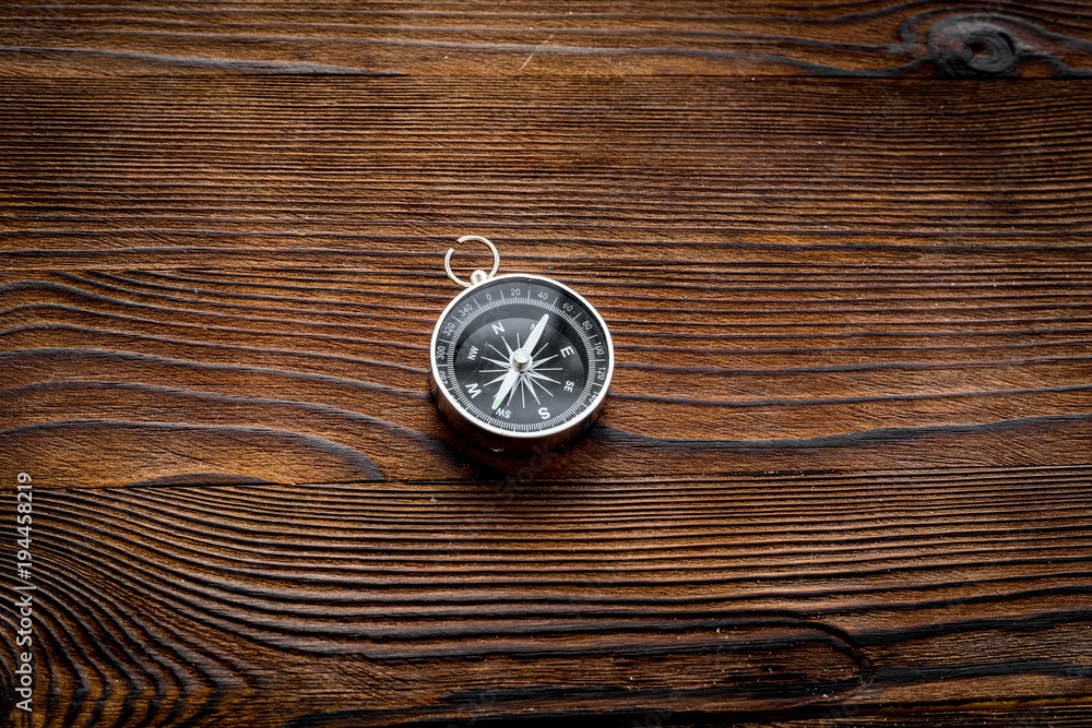 Compass on dark wooden background top view copy space Compass on dark wooden background top view copy space