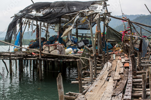 Fishing tackle on Pier made of wooden planks in the fishing village on Ko Chang island, Thailand.