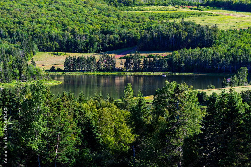 Obraz premium Slow river running through rural North America.