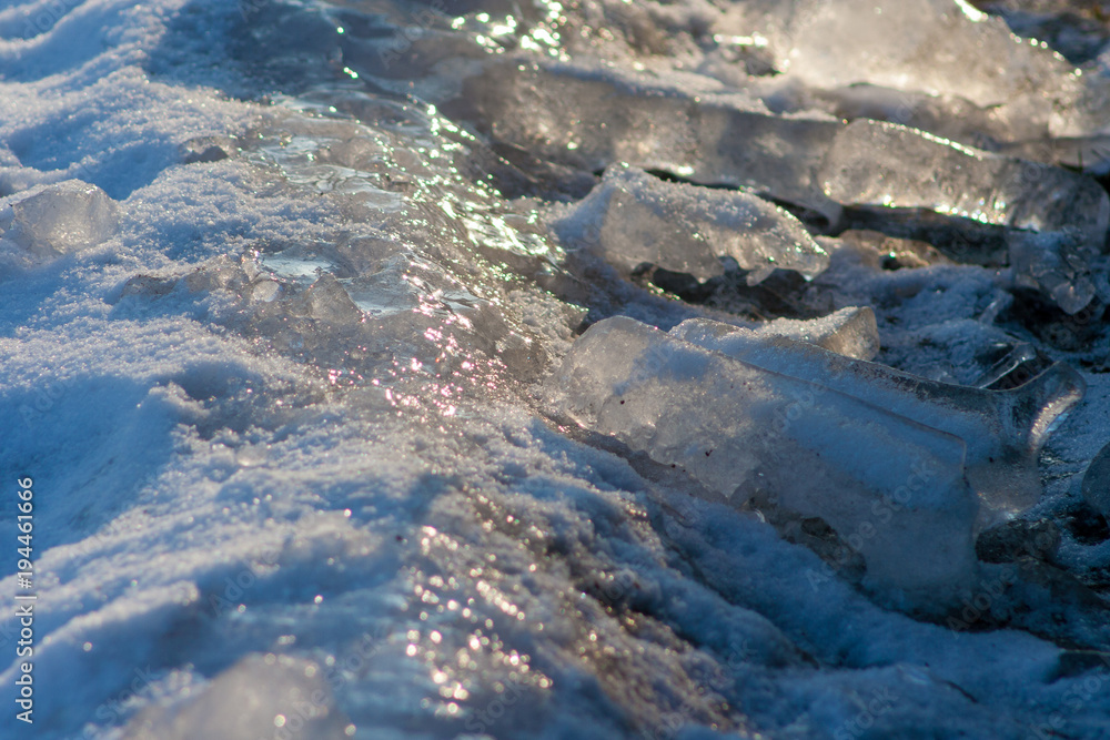 Obraz premium lying on the ground, snow and ice. The sun reflects off the ice.