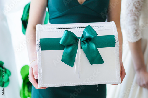wedding box for storing money in the hands of a female witness photo