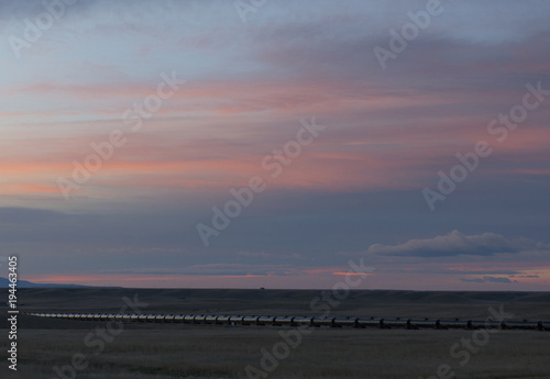 train on the prairie at sunset © Erik