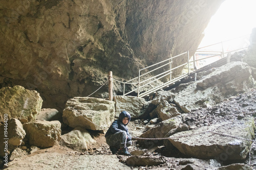 Photography Children explore underground cavern