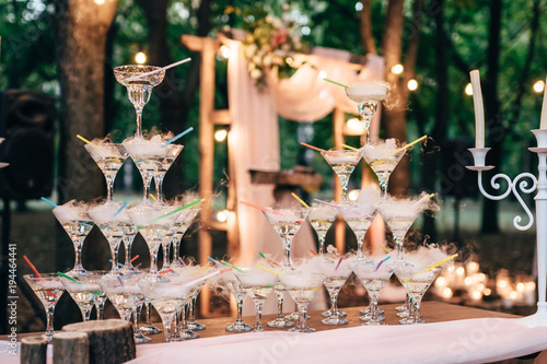 pyramid of champagne and dry ice. holiday outdoors