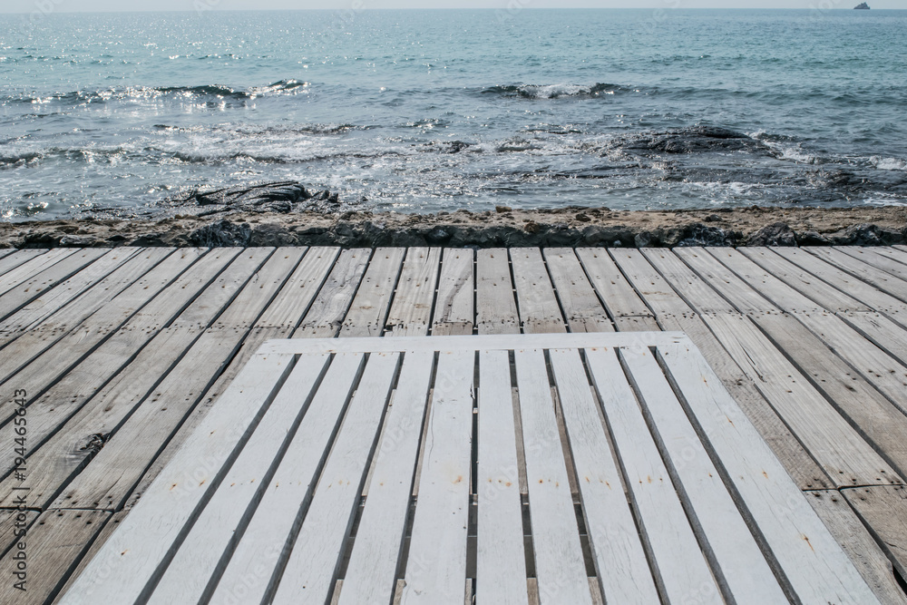 Fototapeta premium wooden beach chair on the floor at seaside