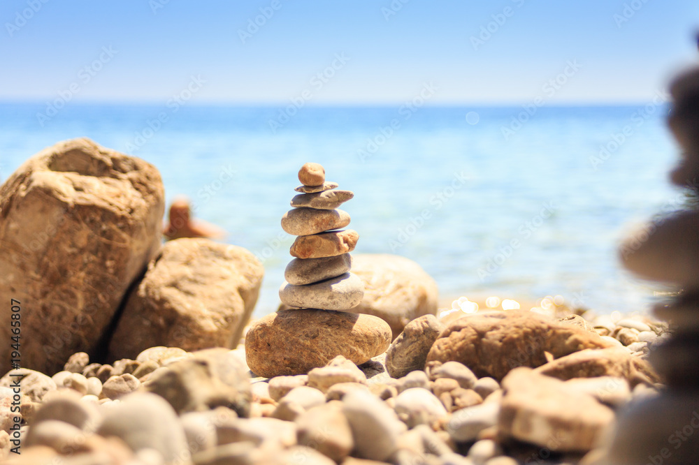 stone tower made of pebbles on the beach stone tower made of pebbles on the beach
