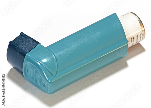 Asthma Inhaler against a white background.