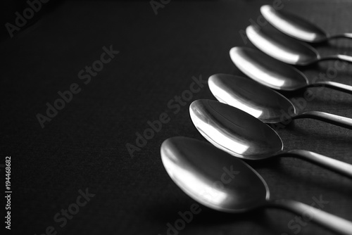 metal spoons on a dark background