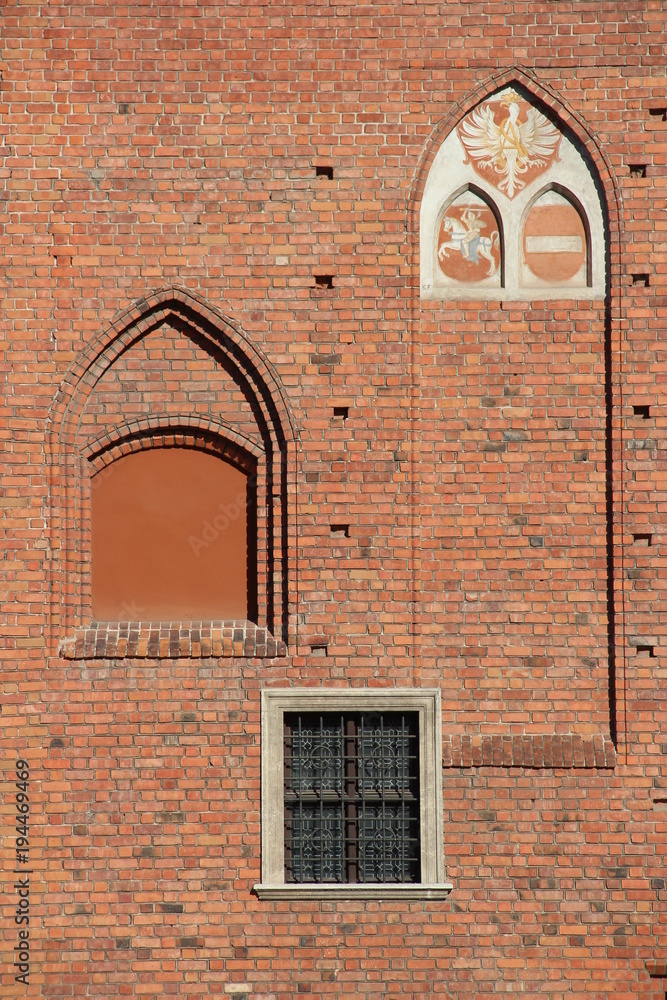 Fotografie Brink wall with unique architectural shapes and windows