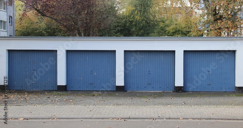 Blue four car garage builing