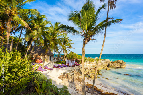 Recreation at paradise beach resort with turquoise waters of Caribbean Sea at Tulum  close to Cancun  Riviera Maya  tropical destination for vacation  Mexico