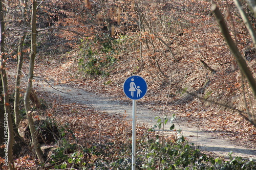 Hiking trail with blue pedestrian children walking sign