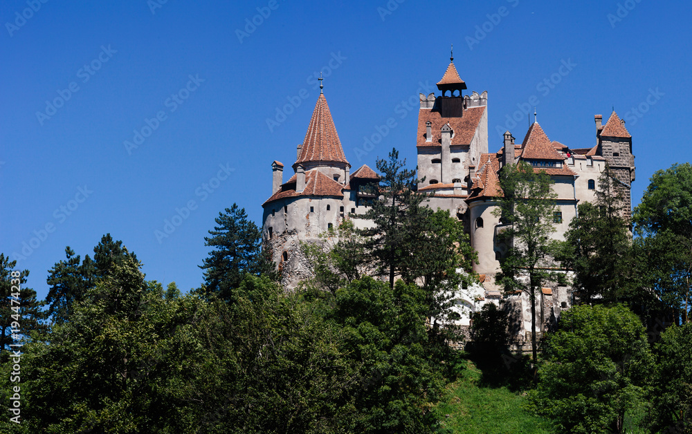 View of Bran castle on Bright sunny day. It is famous for the myth of Dracula. Travel postcard. Location Transylvania, Romania.