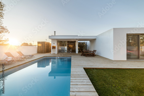 Modern house with garden swimming pool and wooden deck © Luis Viegas
