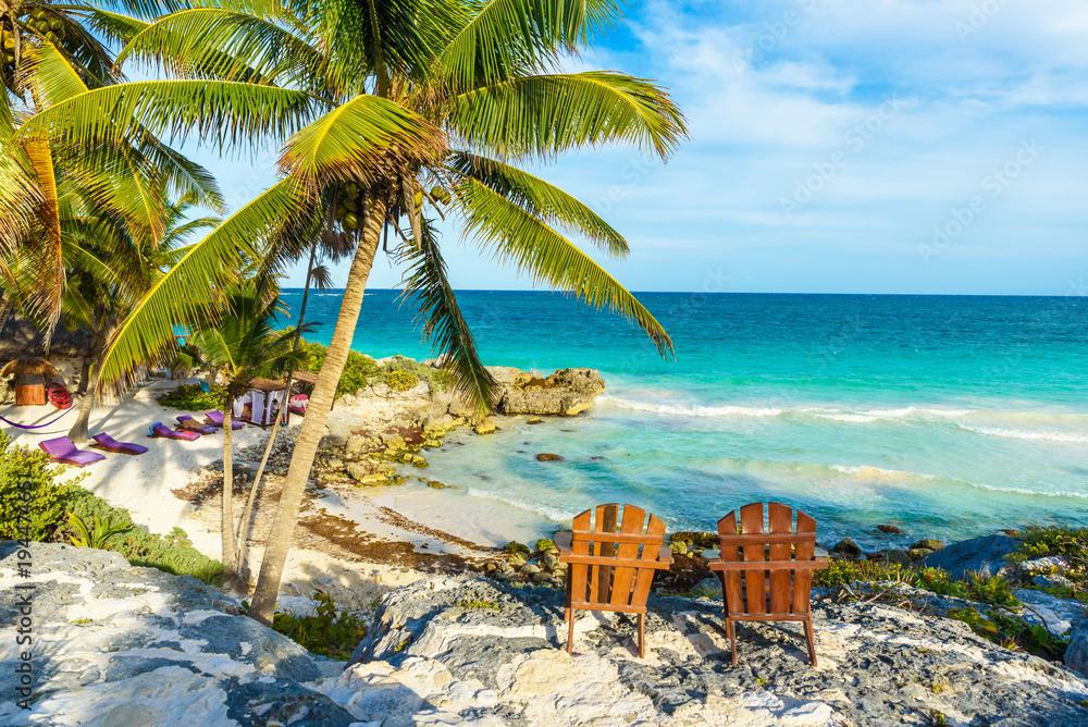 Recreation at paradise beach resort with turquoise waters of Caribbean Sea at Tulum, close to Cancun, Riviera Maya, tropical destination for vacation, Mexico - obrazy, fototapety, plakaty 